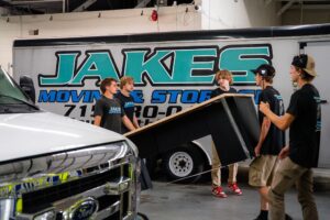 Jake’s Moving & Storage: professional movers carefully relocating furnitures - difficult items to move